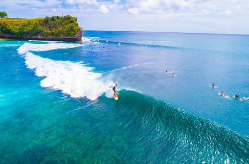 <em>Surfing at Balangan beach</em>