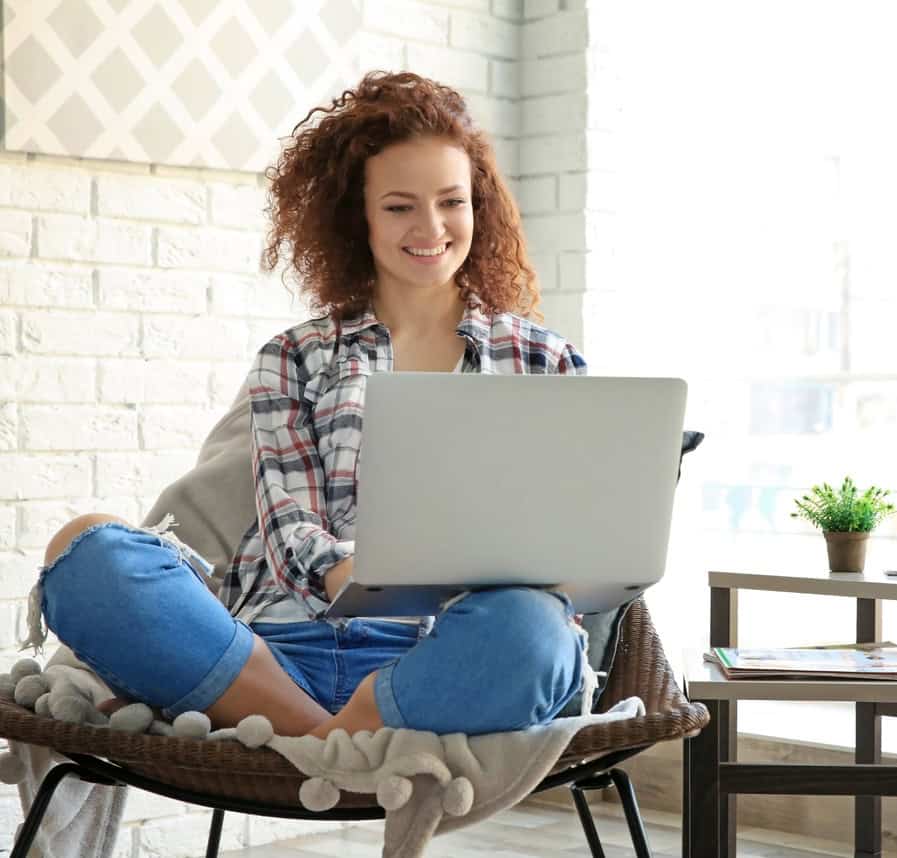 Lady sitting at computer.