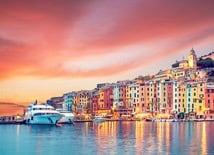 Cruise ship sailing the Western Mediterranean near Portugal’s coastline with sunlit waters