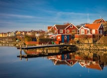 Swedish homes along a calm dock