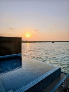 Sunset from balcony in overwater villa in the Maldives