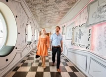 Young couple exploring a Disney cruise ship on holiday