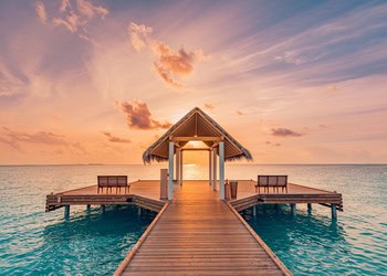 magical overwater pier ideal for watching the sunset on your honeymoon. Where Lovers Wander