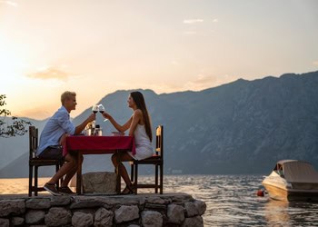 Couple having a romantic dinner for two at sunset. Where Lovers Wander