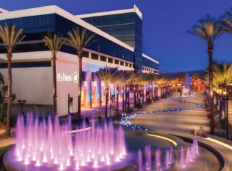Hilton hotel exterior showing water feature that lights up in front of building