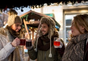Friends enjoying glasses of mulled wine