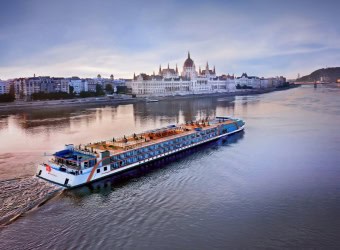 a moving cruise is captured in the middle of southeast europe river